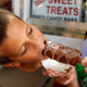 A kid chows down on deep fried butter-on-a-stick at the Iowa State Fair in 2011.